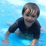 A boy playing in the pool